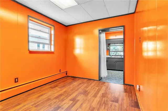 a view of a kitchen with a sink and cabinets