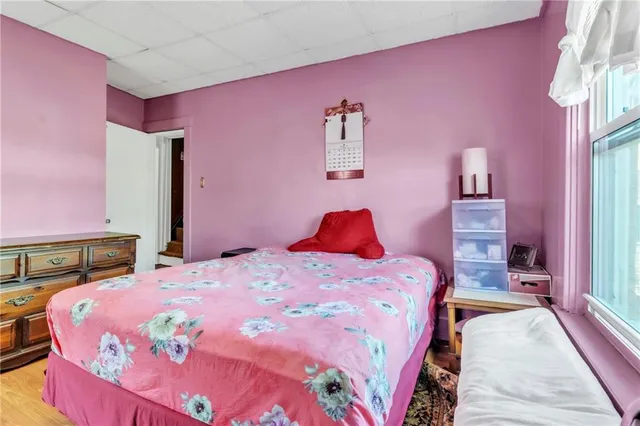 a bedroom with a bed and a dresser