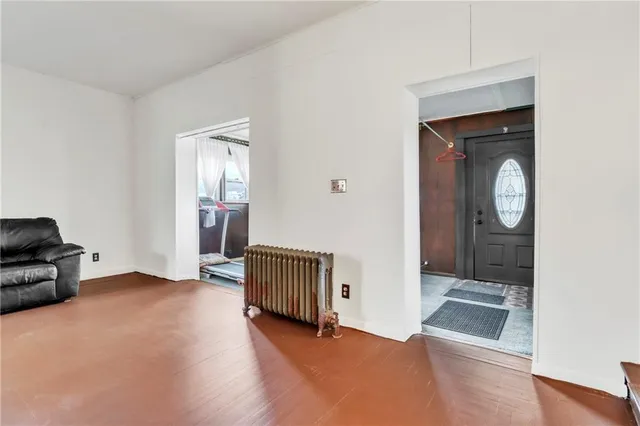 a view of a livingroom with furniture and a fireplace