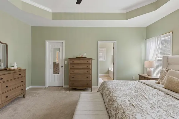 a bedroom with a bed and furniture