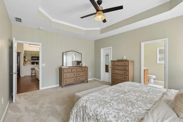 a bedroom with a bed and dresser