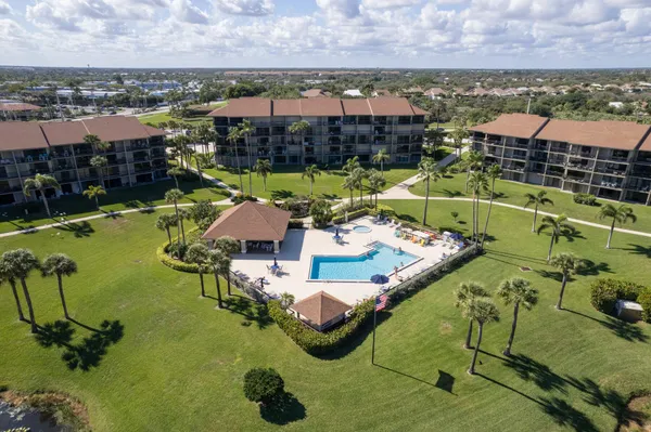 a view of swimming pool with outdoor seating and yard