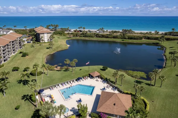 an aerial view of a residential building with outdoor space