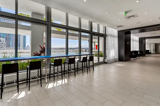 a view of a dining room with furniture window and outside view