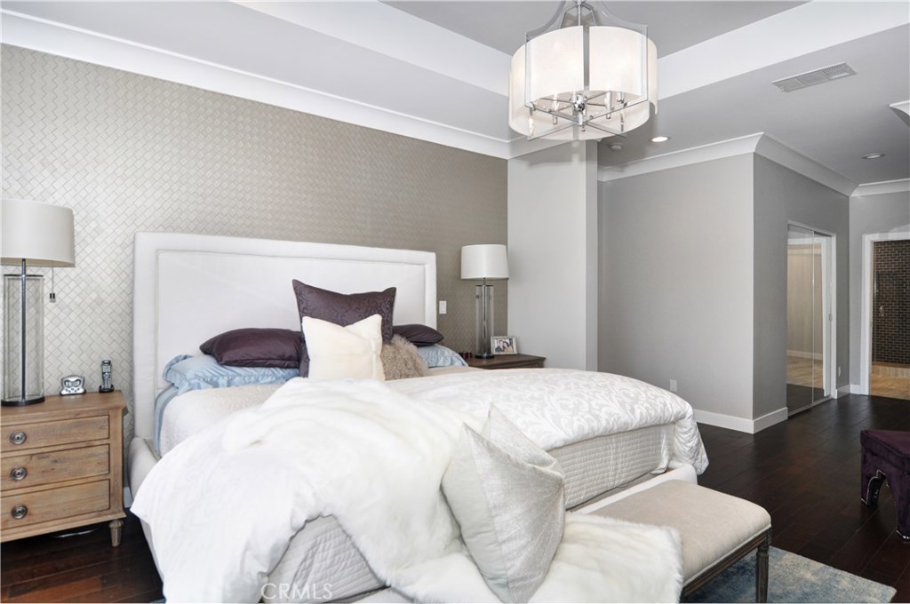 2339 Westminster Avenue Costa Mesa, CA 92627 - Photo 15 of 36 a bedroom with a bed and wooden floor