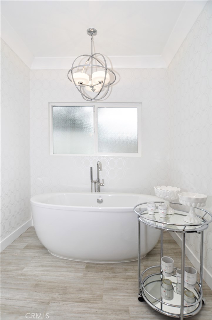 2339 Westminster Avenue Costa Mesa, CA 92627 - Photo 18 of 36 a bathroom with a bathtub and shower