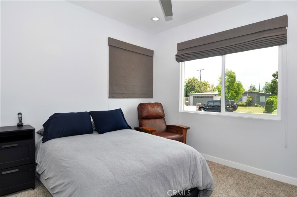 2339 Westminster Avenue Costa Mesa, CA 92627 - Photo 20 of 36 a bedroom with a large bed and a large window