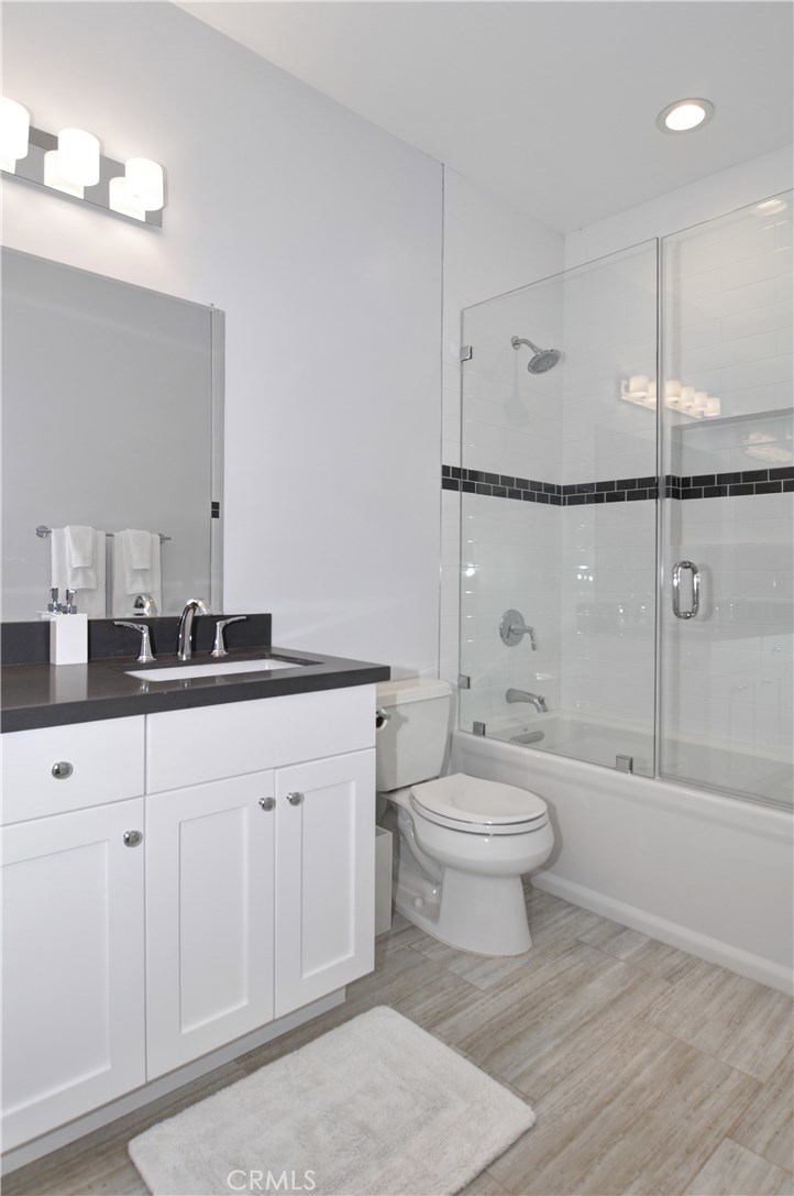 2339 Westminster Avenue Costa Mesa, CA 92627 - Photo 21 of 36 a bathroom with a sink a toilet and shower