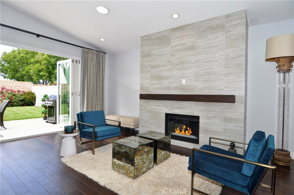 2339 Westminster Avenue Costa Mesa, CA 92627 - Photo 6 of 36 a living room with furniture and a fireplace
