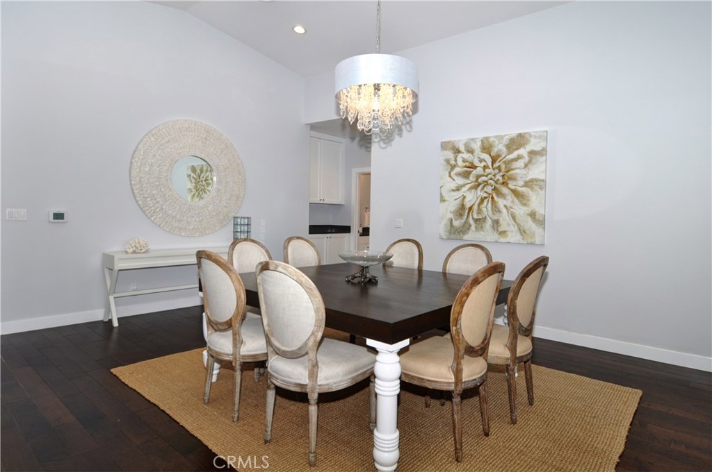 2339 Westminster Avenue Costa Mesa, CA 92627 - Photo 9 of 36 a dining room with furniture and wooden floor