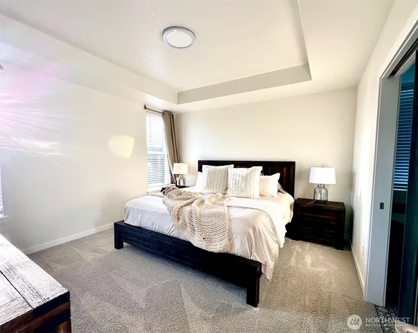 a bathroom with a bathtub and a window