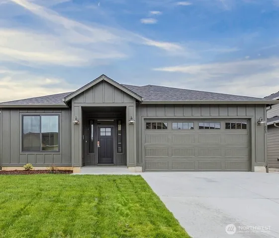 a view of a front of a house with a yard