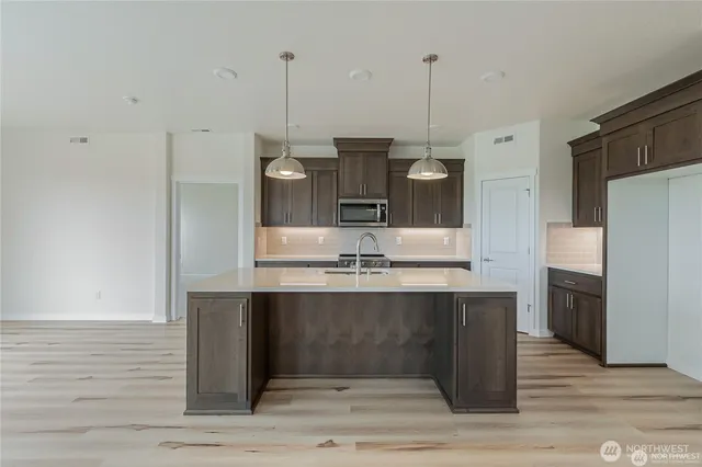 a view of a dining room with furniture and window