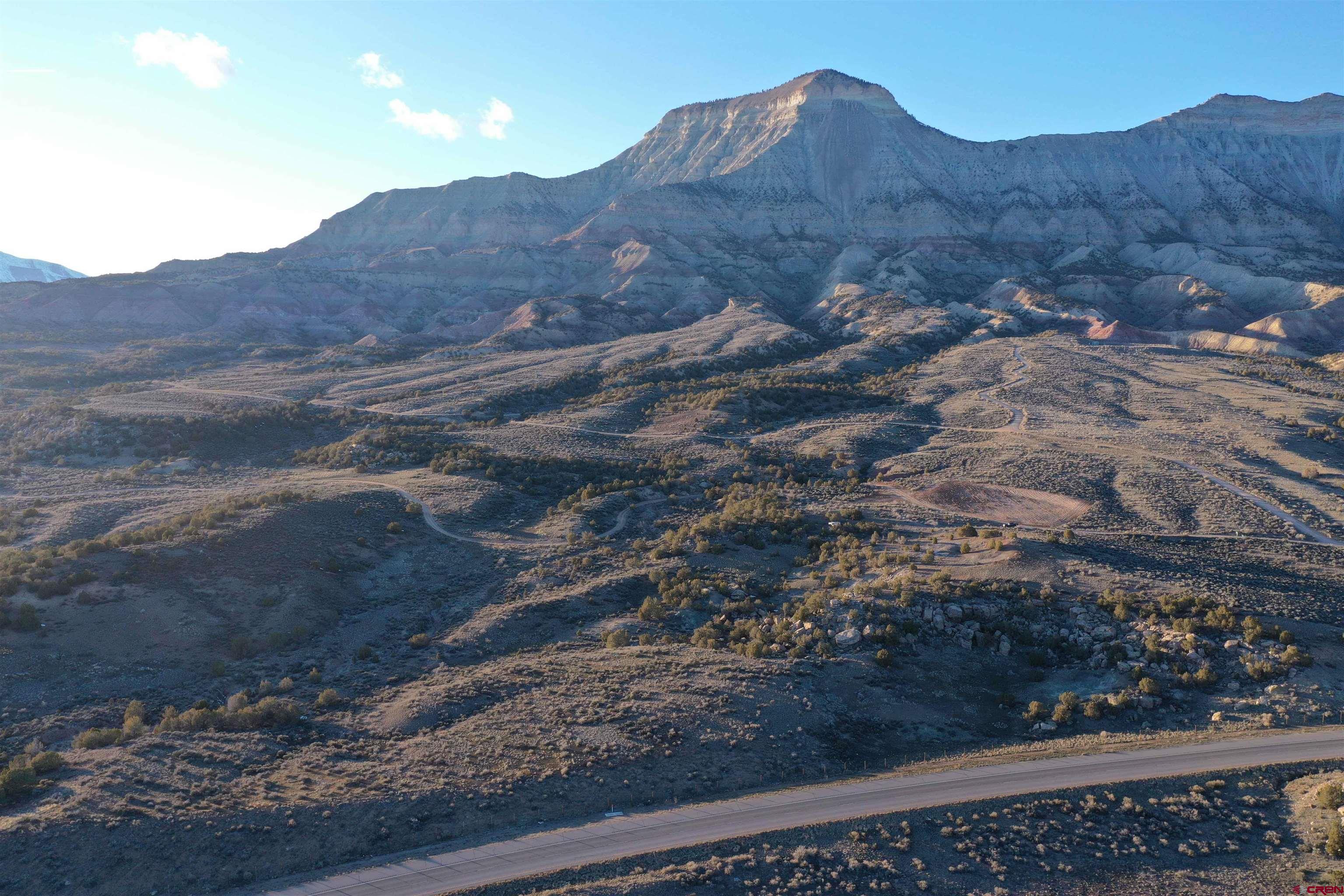 Tbd Highway 6&24 De Beque, CO 81635 - Photo 11 of 14 a view of a dry yard with wooden fence