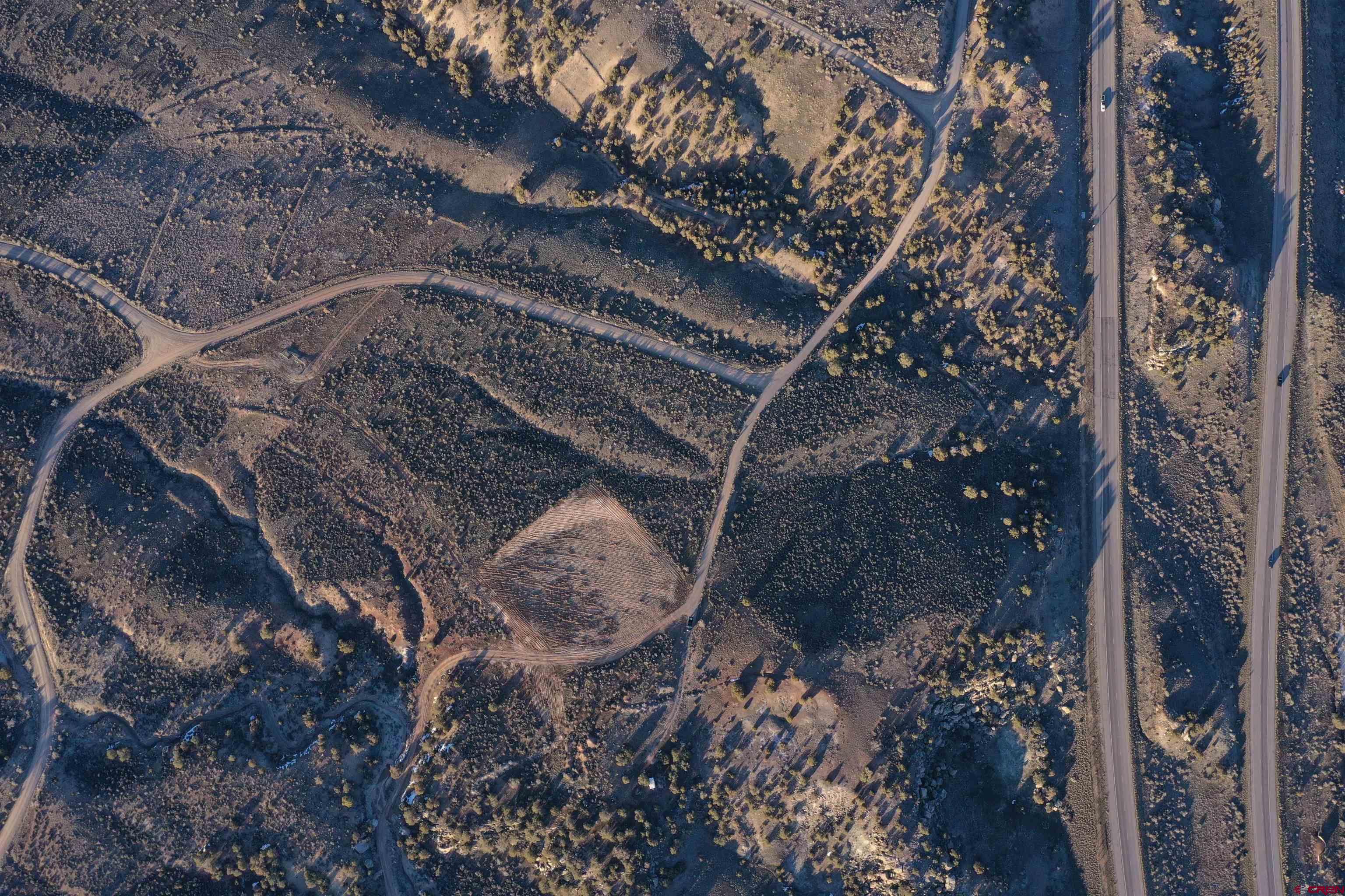Tbd Highway 6&24 De Beque, CO 81635 - Photo 9 of 14 a view of a backyard of a house