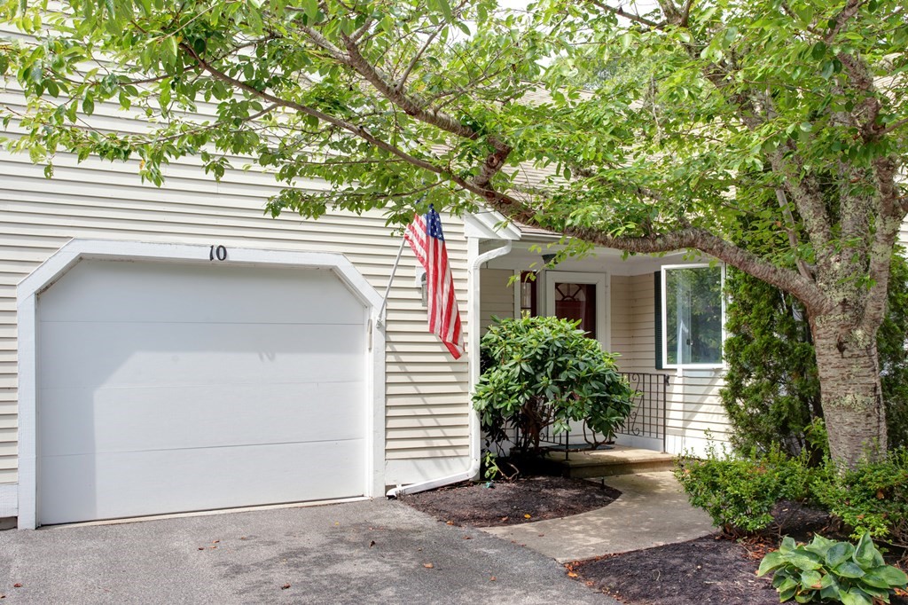 10 Kettle Lane, Unit 10 Mashpee, MA 02649 - Photo 1 of 31 a house view with a outdoor space
