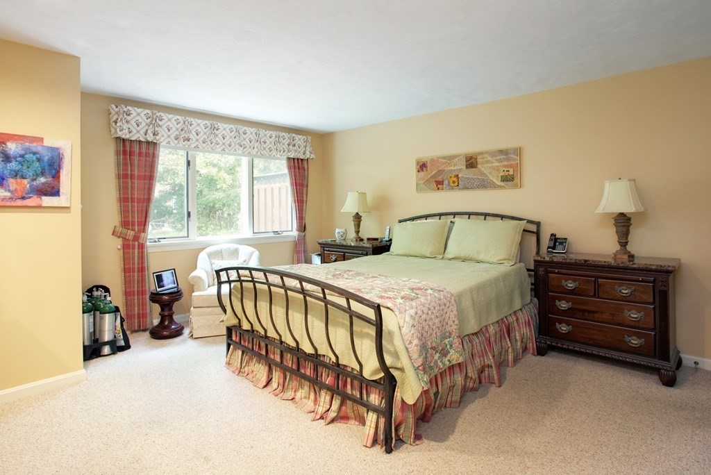 10 Kettle Lane, Unit 10 Mashpee, MA 02649 - Photo 12 of 31 a bedroom with a bed and a window