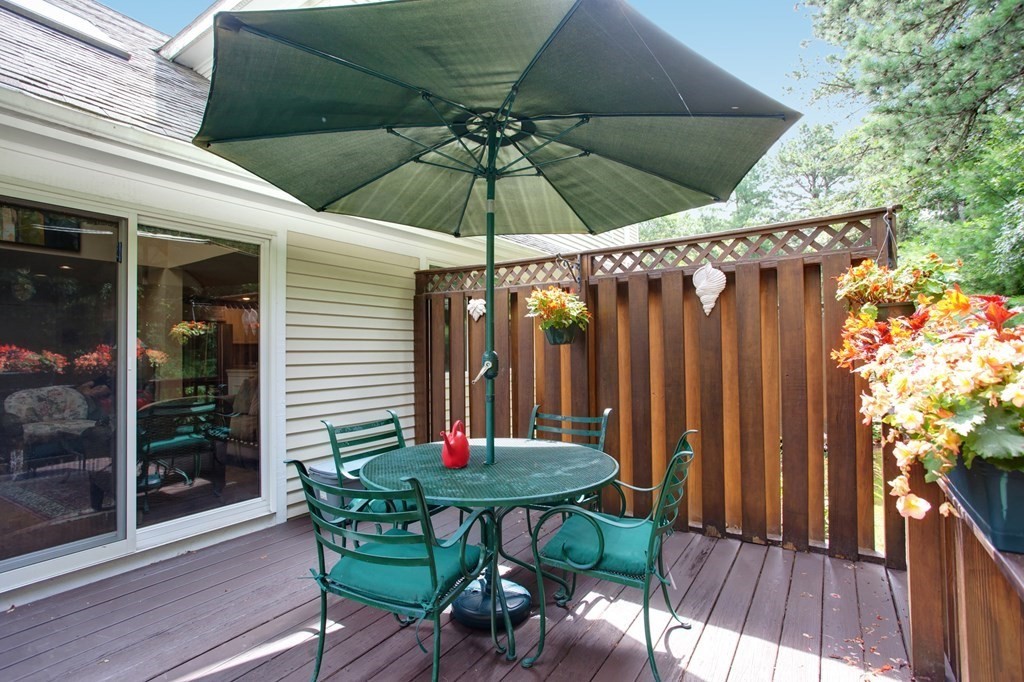 10 Kettle Lane, Unit 10 Mashpee, MA 02649 - Photo 23 of 31 a view of chair and tables in the patio
