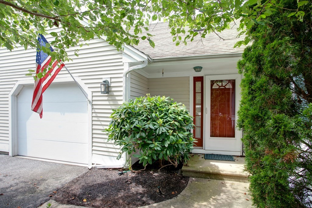 10 Kettle Lane, Unit 10 Mashpee, MA 02649 - Photo 3 of 31 a view of a house with a small yard