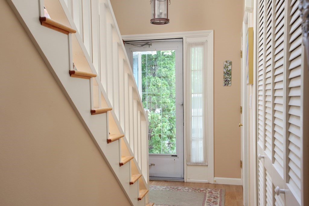 10 Kettle Lane, Unit 10 Mashpee, MA 02649 - Photo 4 of 31 a view of an entryway with a floor to ceiling window