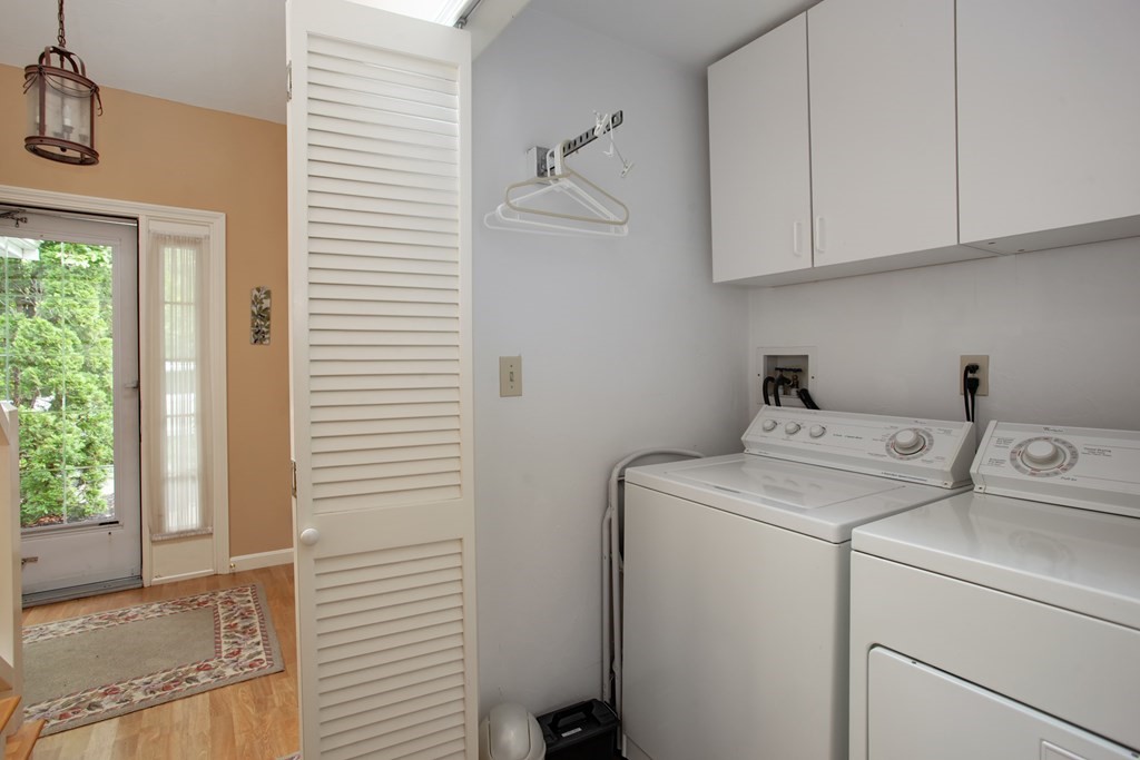10 Kettle Lane, Unit 10 Mashpee, MA 02649 - Photo 5 of 31 a utility room with dryer and washer