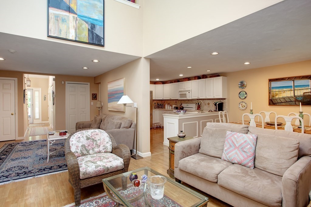 10 Kettle Lane, Unit 10 Mashpee, MA 02649 - Photo 7 of 31 a living room with furniture and kitchen view