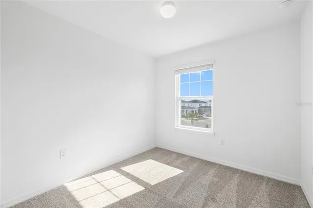 a view of a hallway with wooden shelves