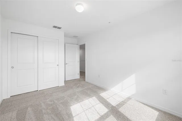 a bathroom with a bathtub shower sink vanity and toilet