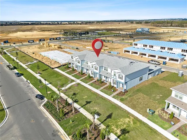 a view of swimming pool with lawn chairs