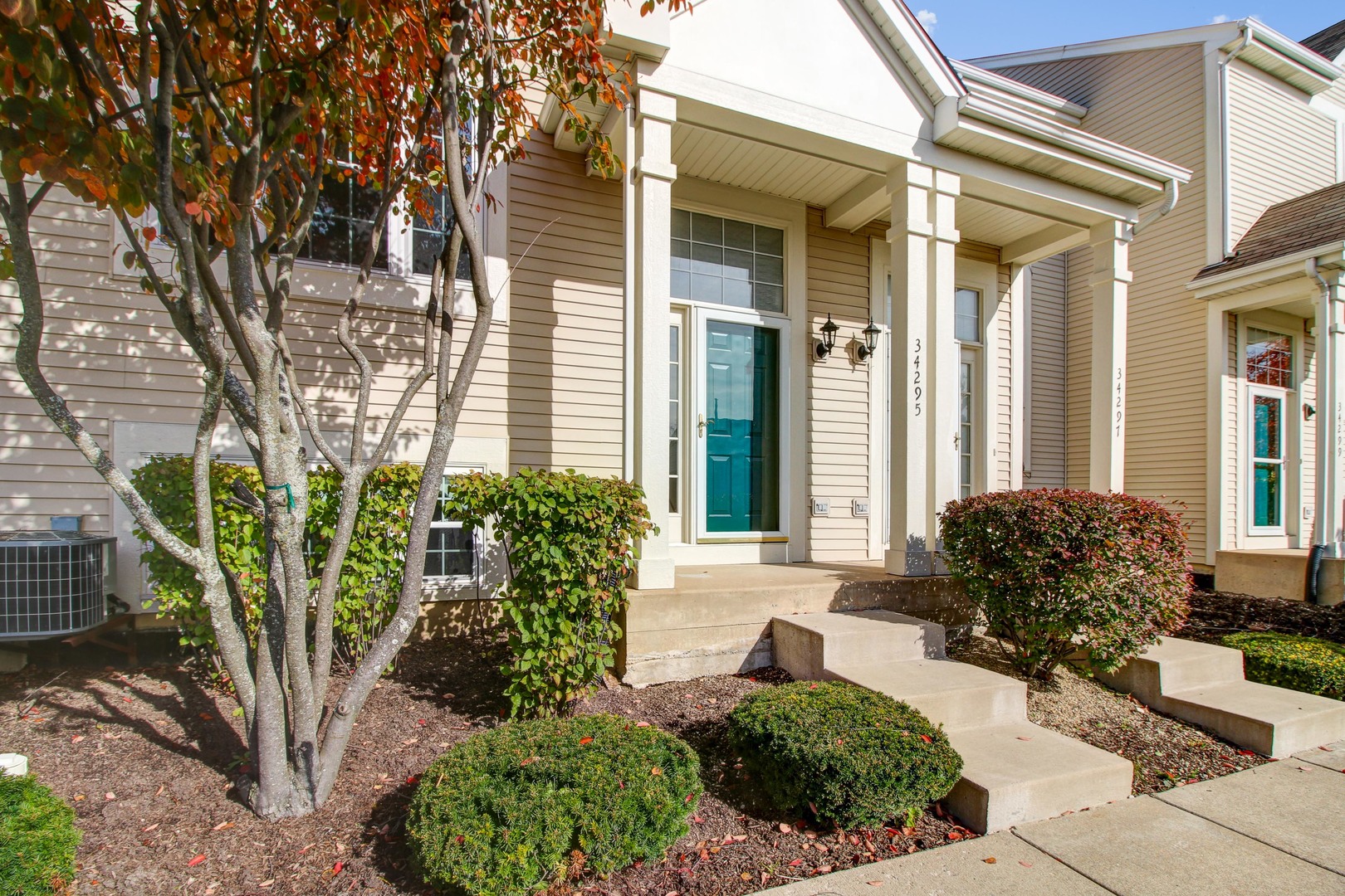 34295 North Barberry Road Round Lake, IL 60073 - Photo 1 of 23 a view of a house with a small garden