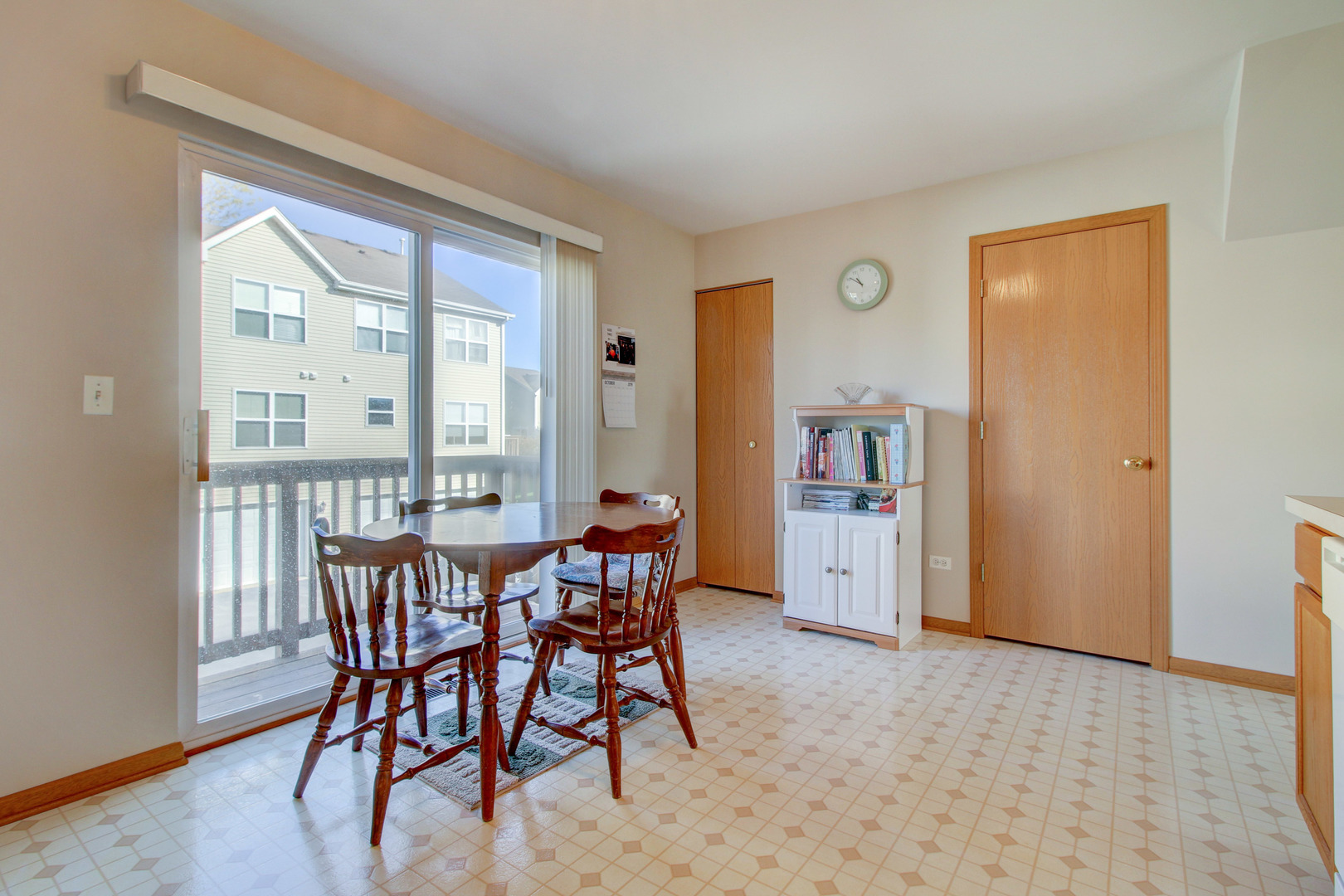 34295 North Barberry Road Round Lake, IL 60073 - Photo 12 of 23 a view of a dining room with furniture and a large window
