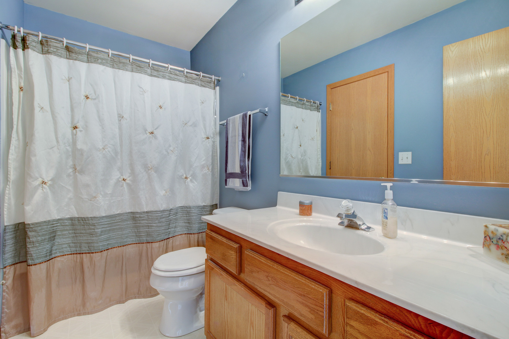 34295 North Barberry Road Round Lake, IL 60073 - Photo 18 of 23 a bathroom with a sink a toilet and shower