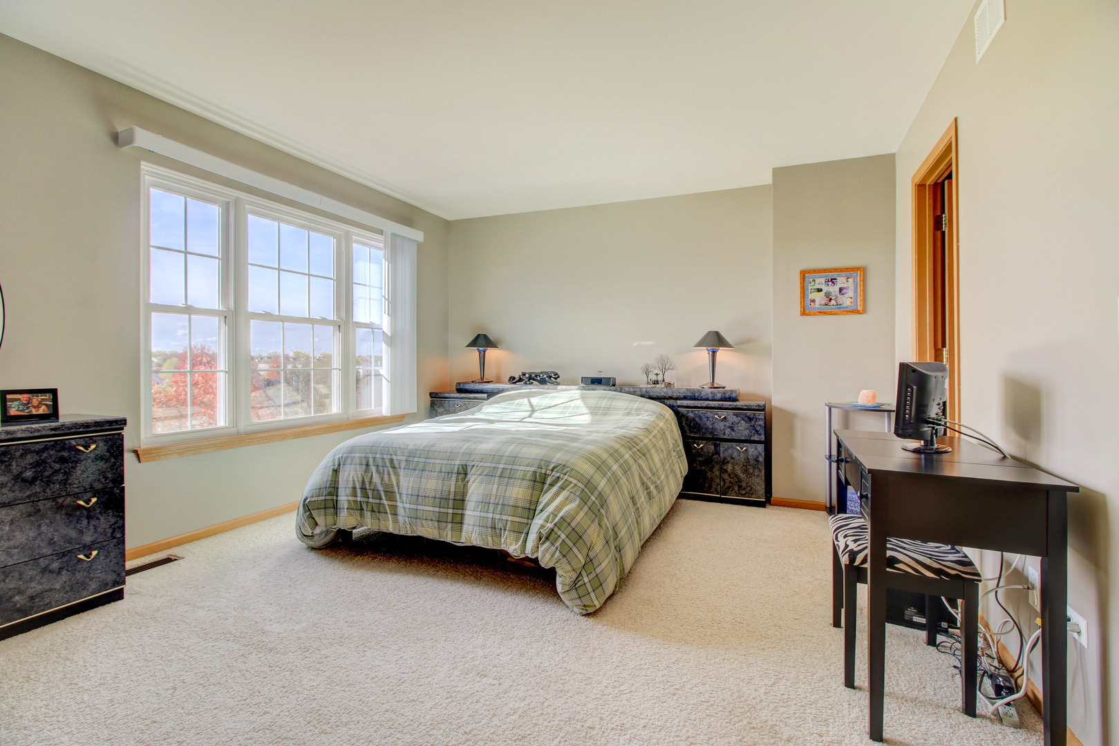 34295 North Barberry Road Round Lake, IL 60073 - Photo 20 of 23 a bedroom with a bed table chair and a window
