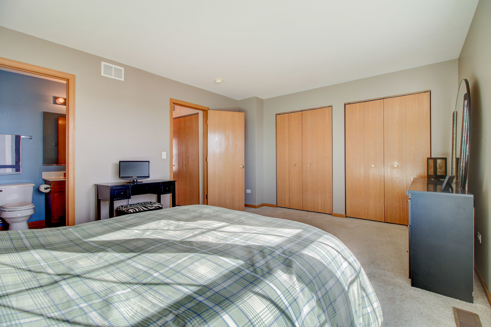 34295 North Barberry Road Round Lake, IL 60073 - Photo 22 of 23 a bed sitting in a spacious bedroom next to a window