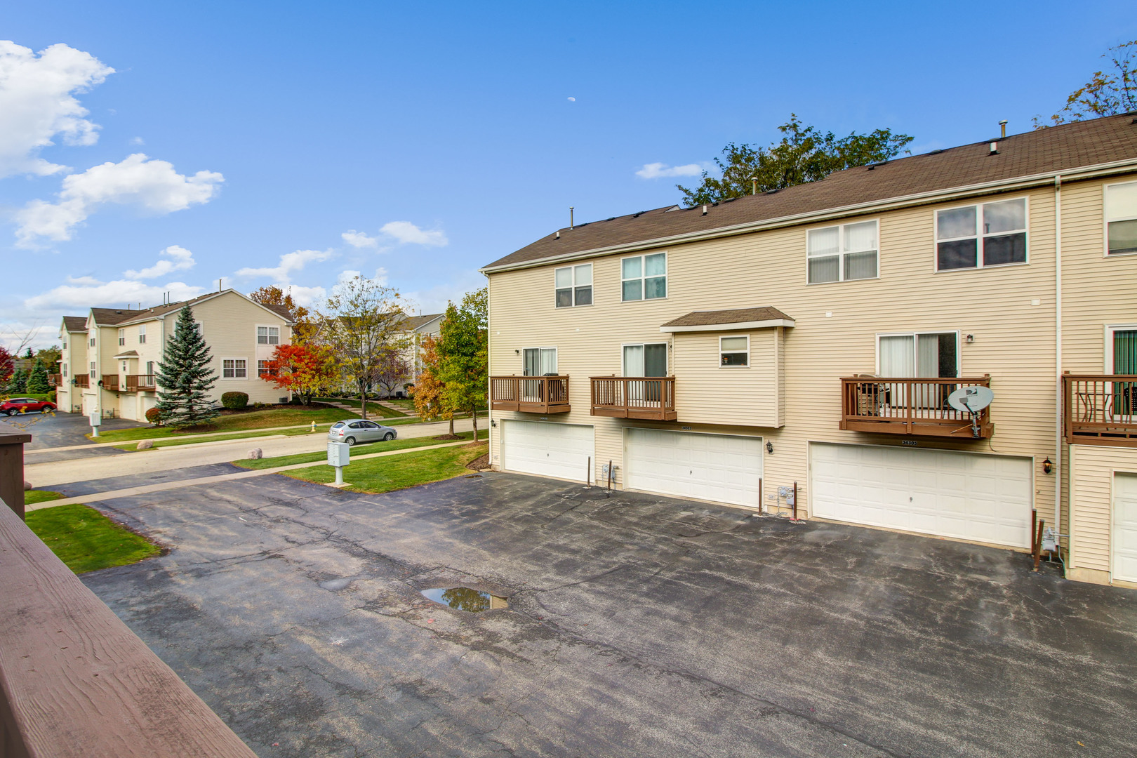 34295 North Barberry Road Round Lake, IL 60073 - Photo 4 of 23 a view of a white house with a big yard and a large tree