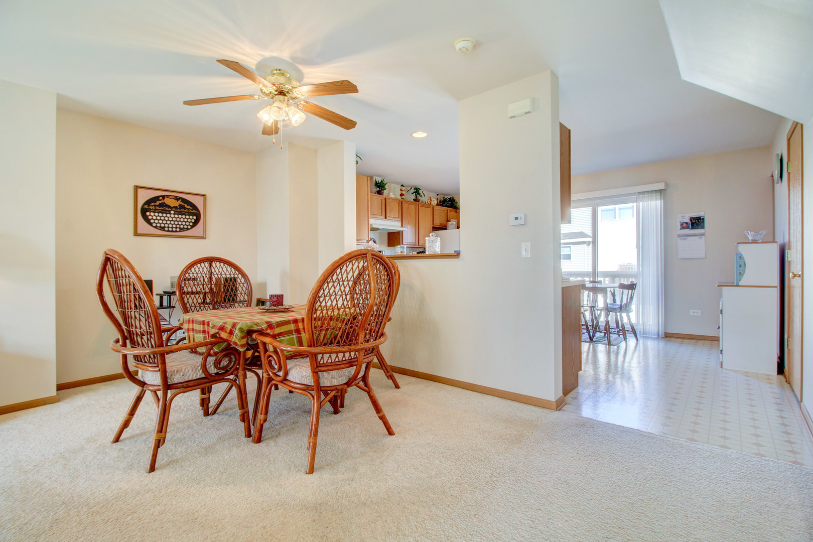 34295 North Barberry Road Round Lake, IL 60073 - Photo 6 of 23 a view of a dining room with furniture and a chandelier