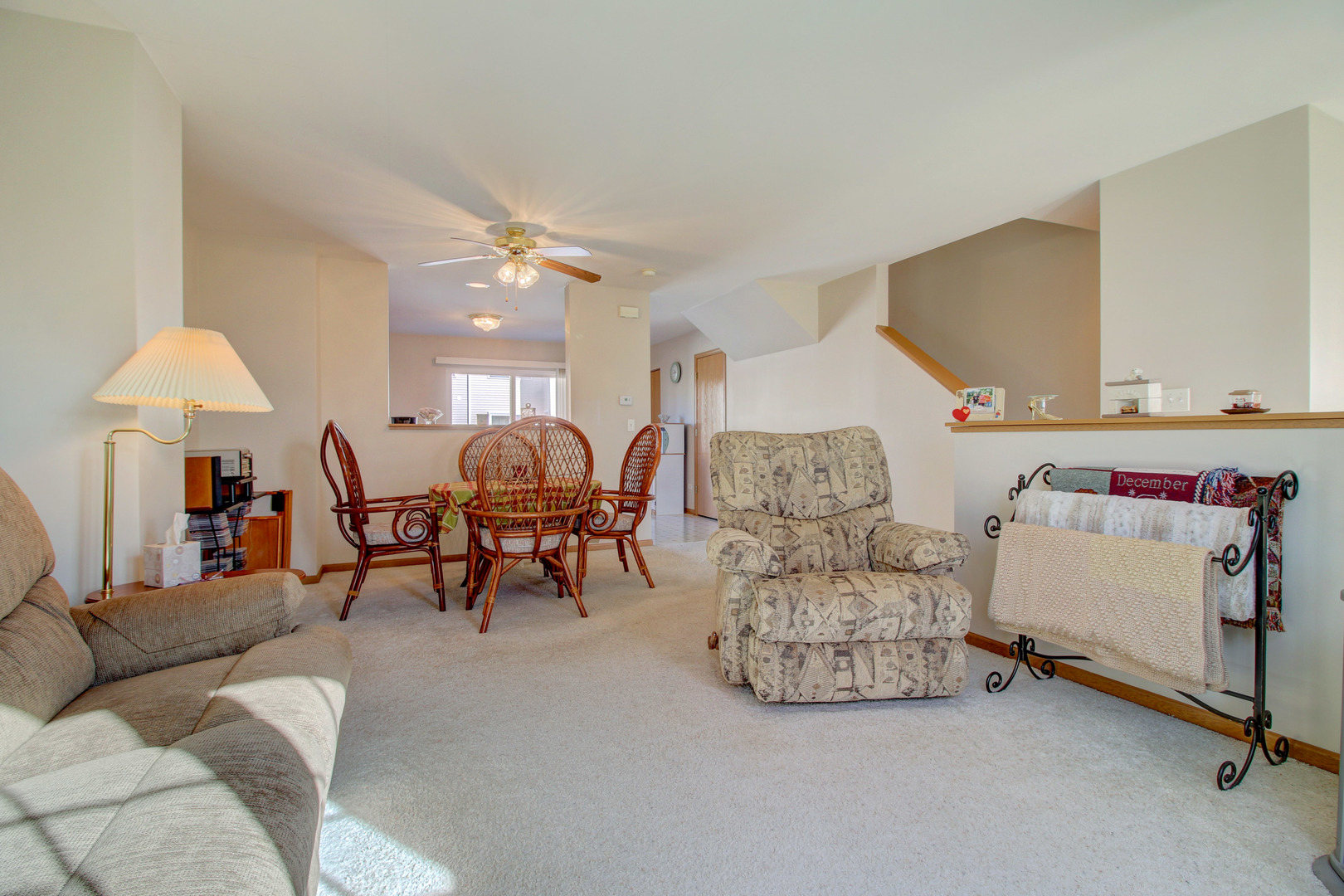 34295 North Barberry Road Round Lake, IL 60073 - Photo 8 of 23 a living room with furniture and a chandelier