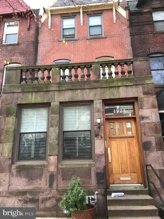 a front view of a building with a glass door