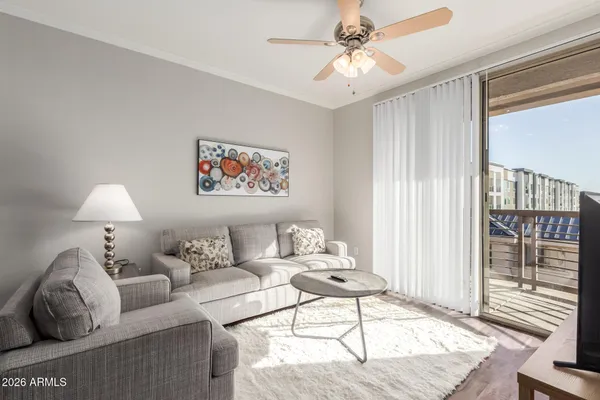 a living room with furniture and a window