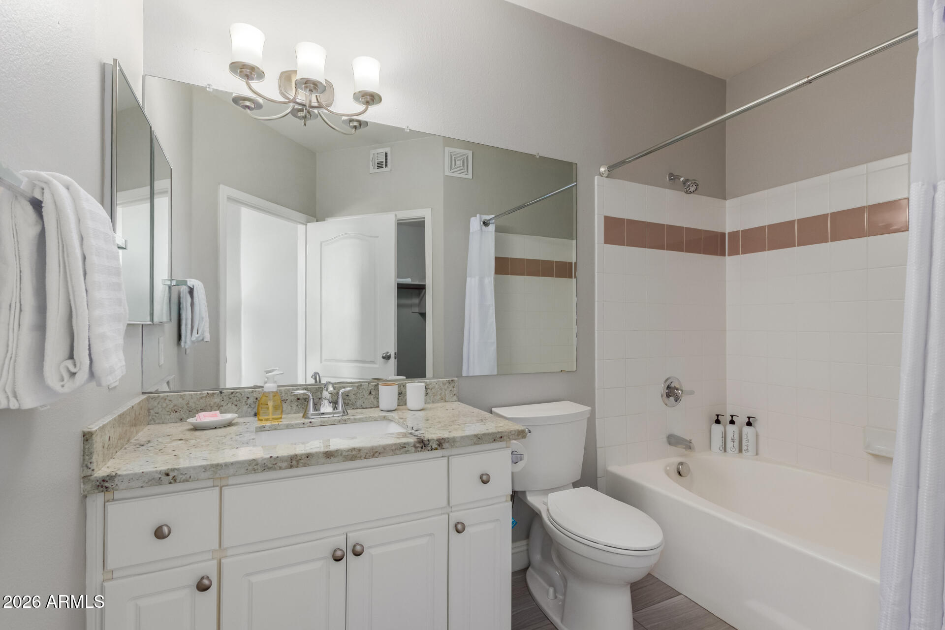 1701 East Colter Street, Unit 477 Phoenix, AZ 85016 - Photo 13 of 39 a bathroom with a granite countertop sink toilet and shower