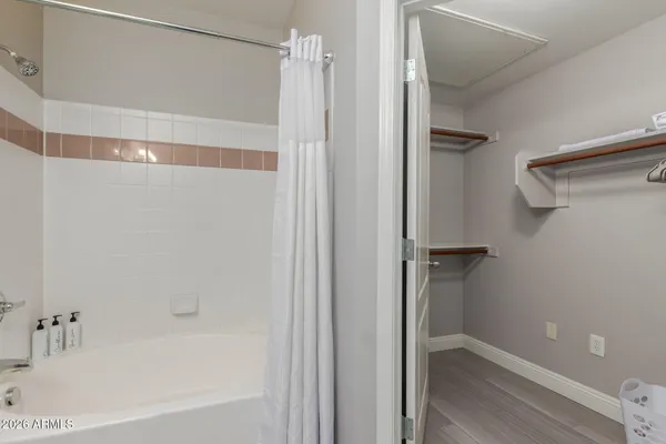 a bathroom with a bathtub and a shower