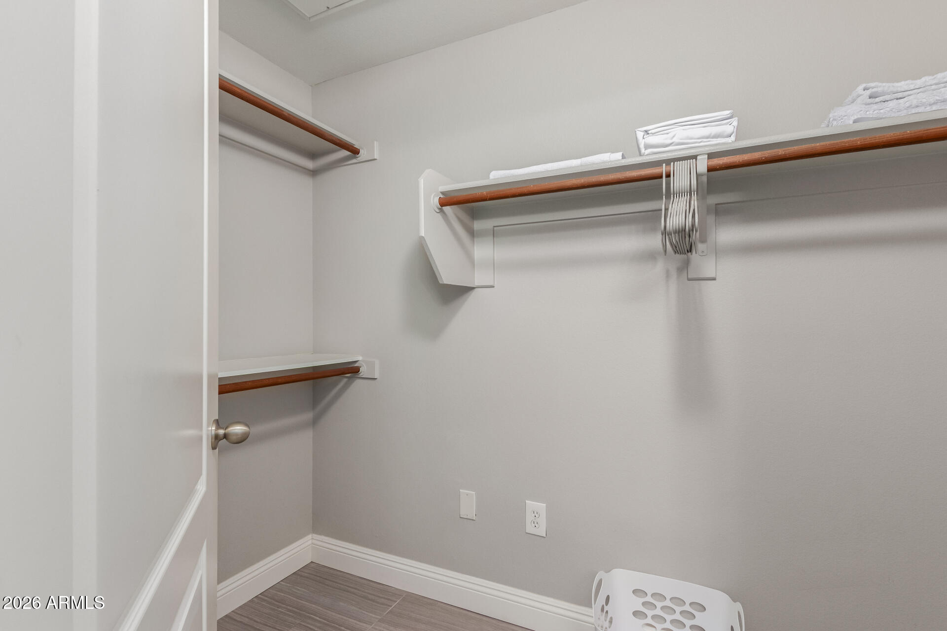 1701 East Colter Street, Unit 477 Phoenix, AZ 85016 - Photo 15 of 39 a view of a room with racks on the wall