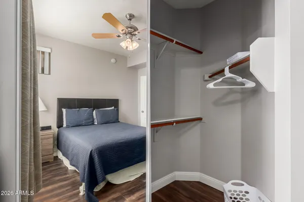 a bedroom with a bed and a chandelier