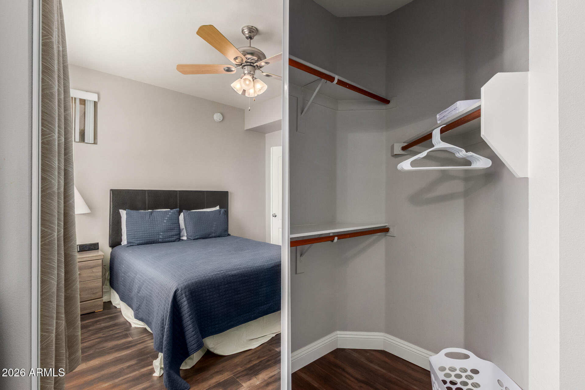 1701 East Colter Street, Unit 477 Phoenix, AZ 85016 - Photo 18 of 39 a bedroom with a bed and a chandelier