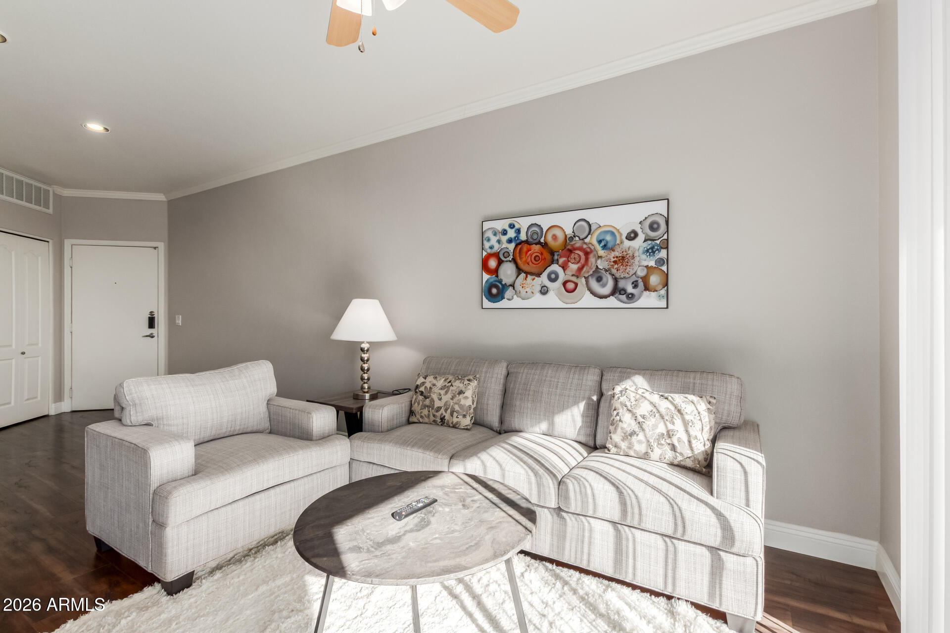 1701 East Colter Street, Unit 477 Phoenix, AZ 85016 - Photo 2 of 39 a living room with furniture a couch and a chandelier