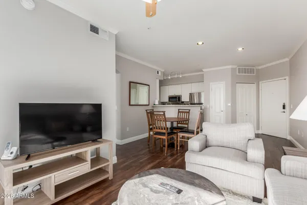 a living room with furniture and a flat screen tv
