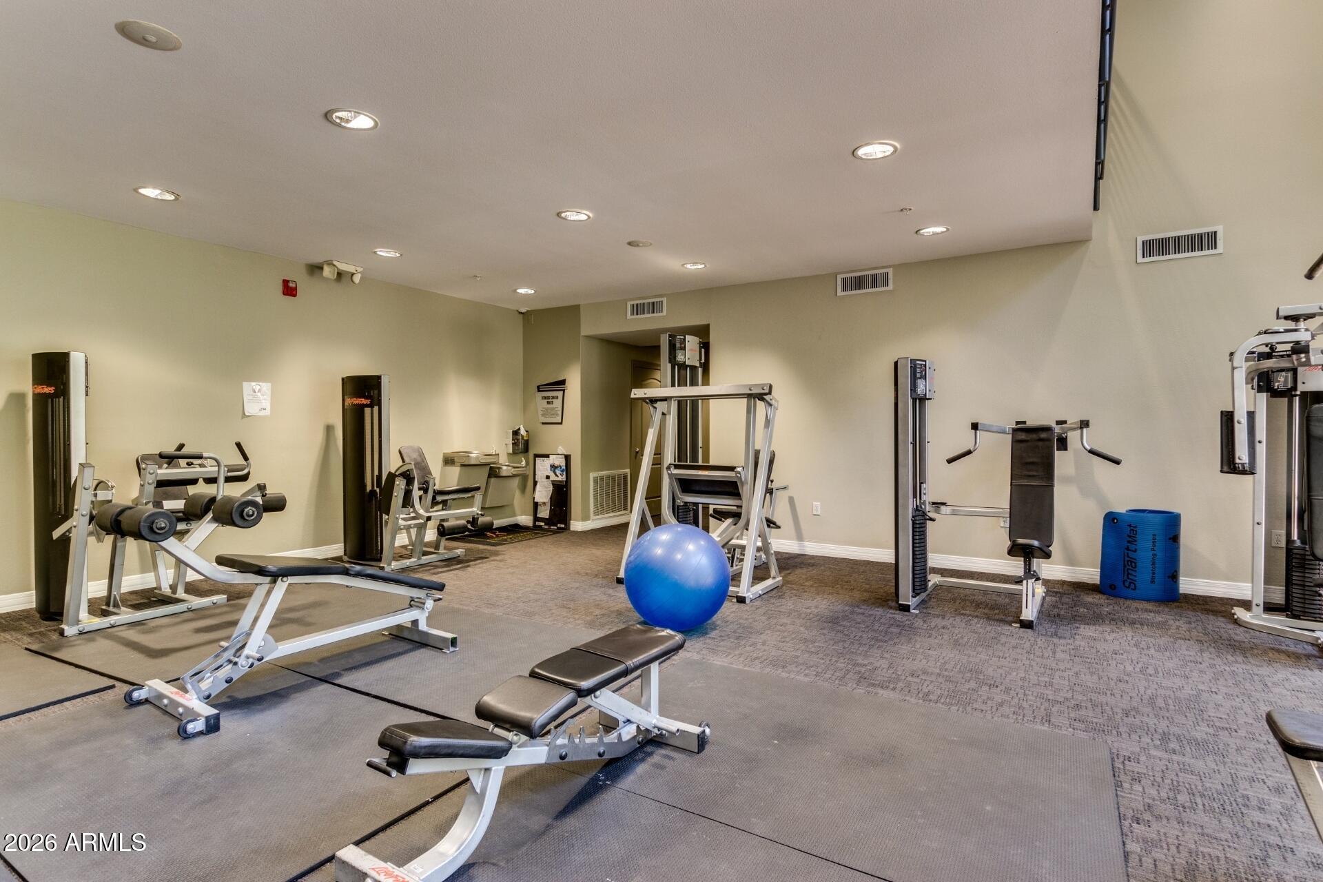 1701 East Colter Street, Unit 477 Phoenix, AZ 85016 - Photo 34 of 39 a view of a room with gym equipment