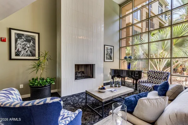 a living room with furniture and a potted plant