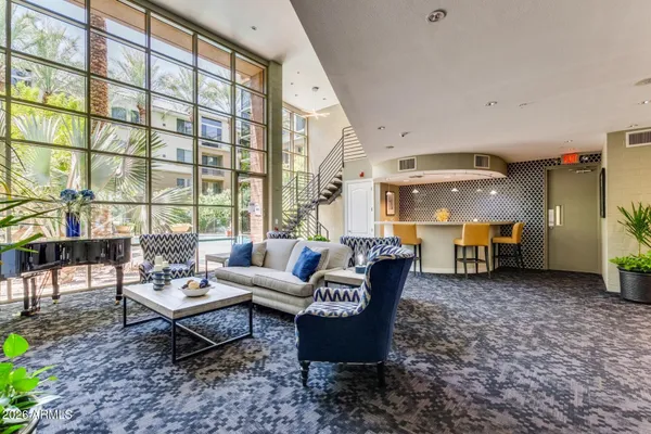a living room with furniture and a large window