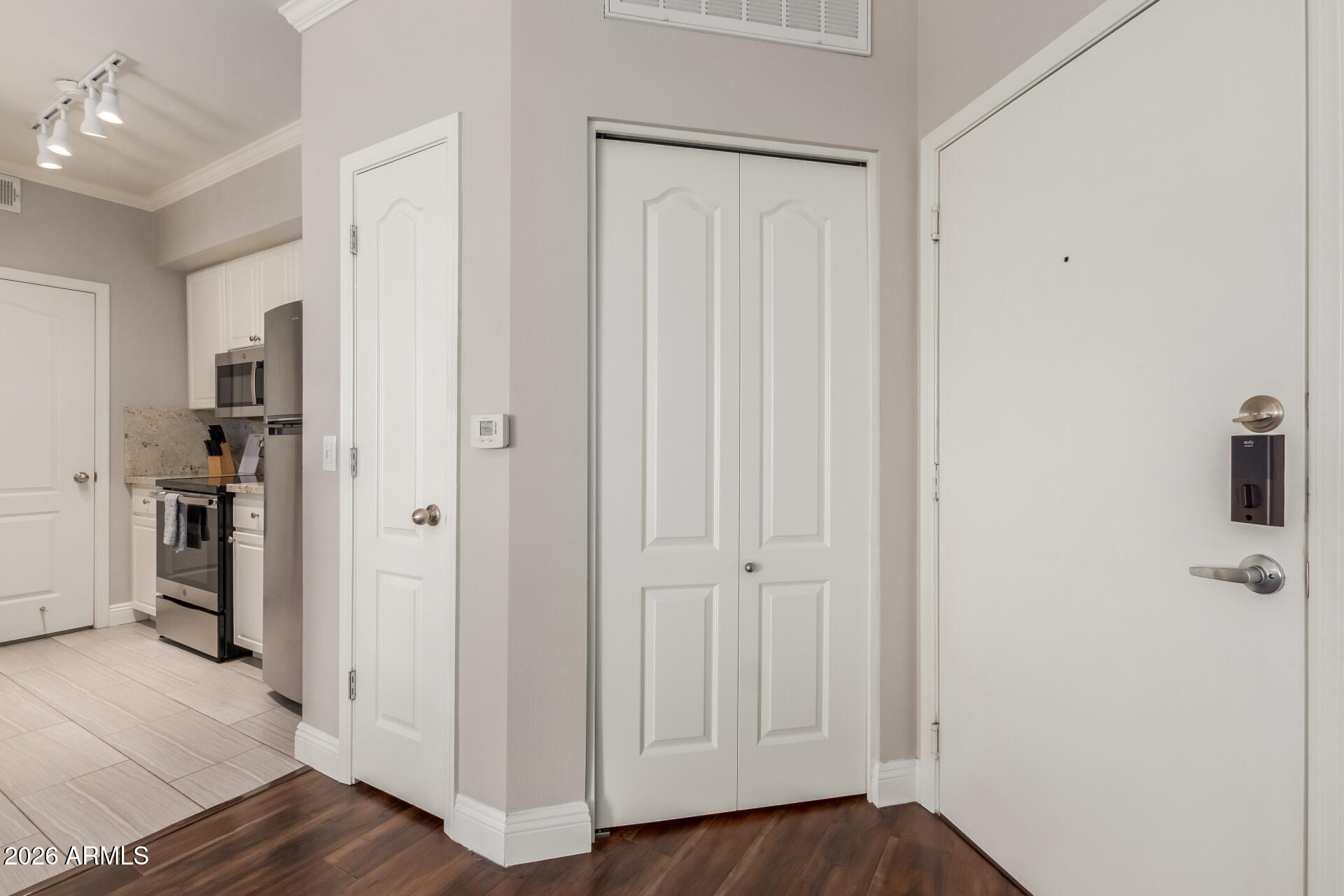 1701 East Colter Street, Unit 477 Phoenix, AZ 85016 - Photo 39 of 39 a view of a hallway with wooden floor and closet